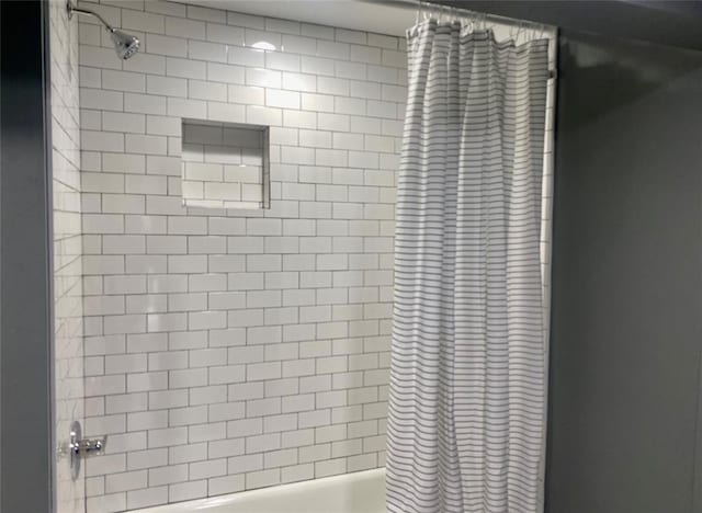 bathroom featuring shower / bath combination with curtain