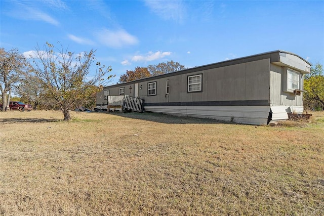 exterior space featuring a lawn and a wooden deck