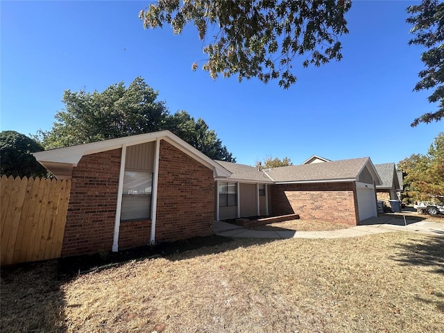 view of side of property with a garage