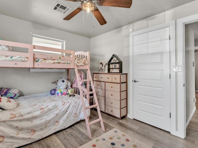 bedroom with ceiling fan and light wood-type flooring