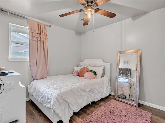 bedroom featuring ceiling fan and dark hardwood / wood-style floors