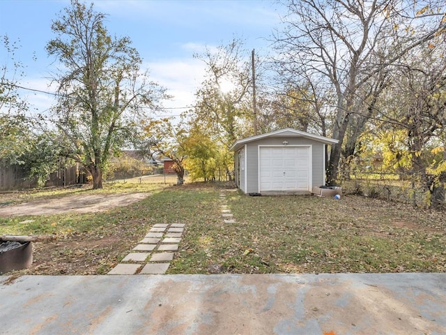 view of yard with an outdoor structure and a garage