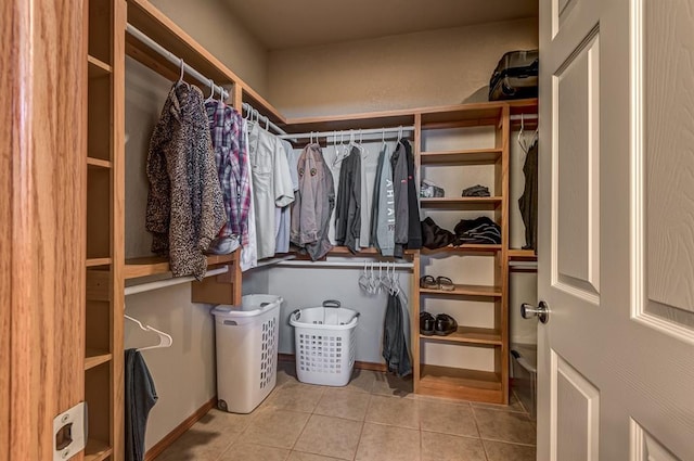 spacious closet featuring light tile patterned flooring