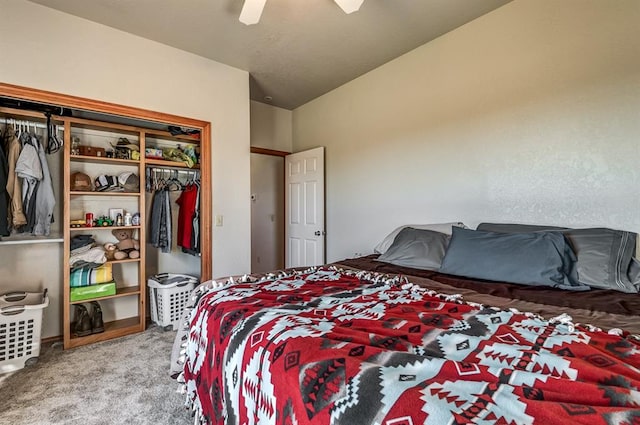 bedroom featuring carpet flooring, a closet, vaulted ceiling, and ceiling fan