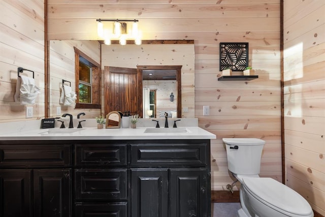 105 Triton Trl, Broken Bow, OK 74728 - bathroom with wooden walls, toilet, and double vanity
