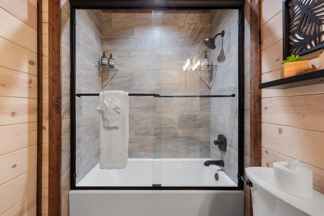 105 Triton Trl, Broken Bow, OK 74728 - full bath with combined bath / shower with glass door, toilet, and wood walls