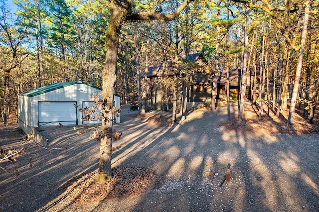 view of front of property featuring an outbuilding and a garage