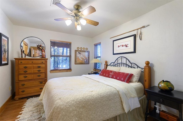 bedroom featuring wood-type flooring and ceiling fan