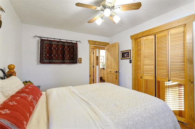 bedroom with ceiling fan and a closet