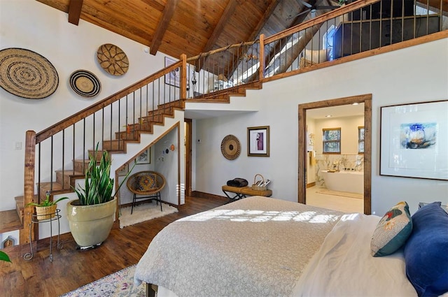 bedroom with dark hardwood / wood-style flooring, ensuite bathroom, wood ceiling, beam ceiling, and high vaulted ceiling