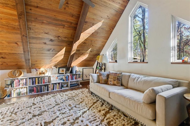 sitting room with lofted ceiling with beams, hardwood / wood-style flooring, and wood ceiling