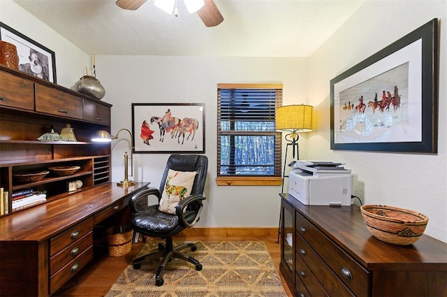 office with ceiling fan and dark wood-type flooring