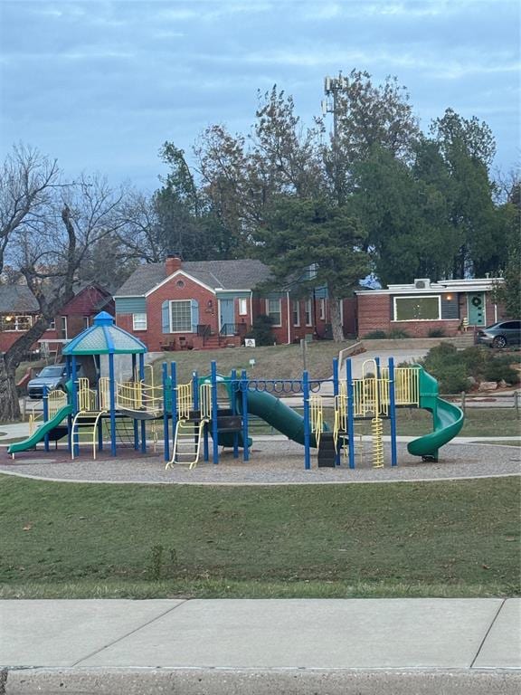 view of playground featuring a lawn