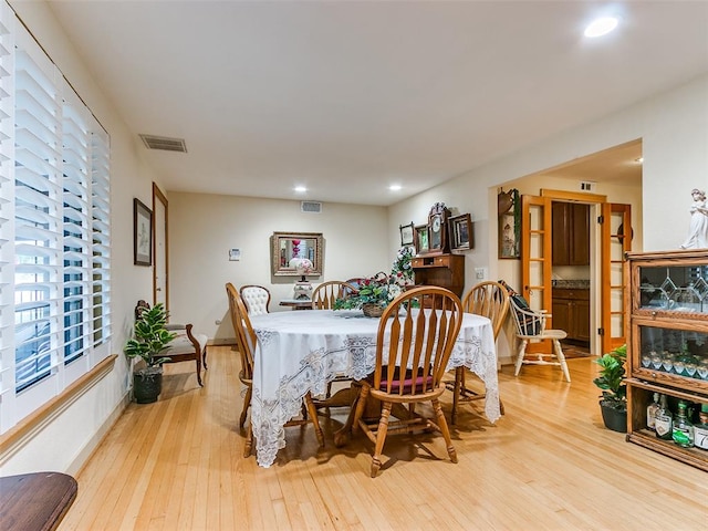 dining room with light hardwood / wood-style flooring