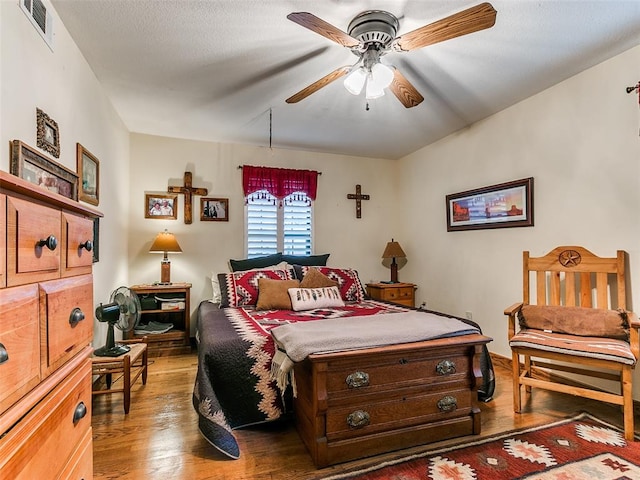 bedroom featuring ceiling fan and wood-type flooring