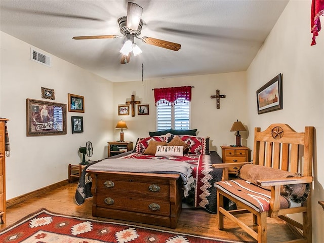 bedroom featuring light wood-type flooring and ceiling fan