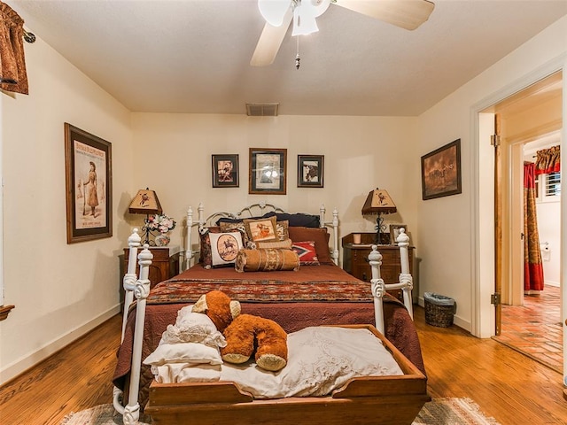 bedroom featuring ceiling fan and light hardwood / wood-style floors