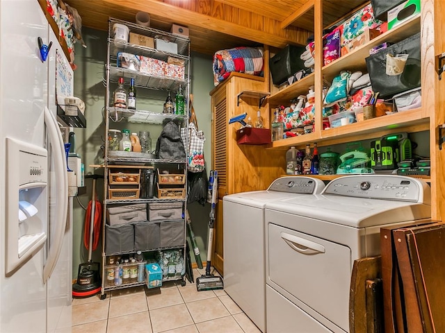 washroom featuring light tile patterned floors and independent washer and dryer