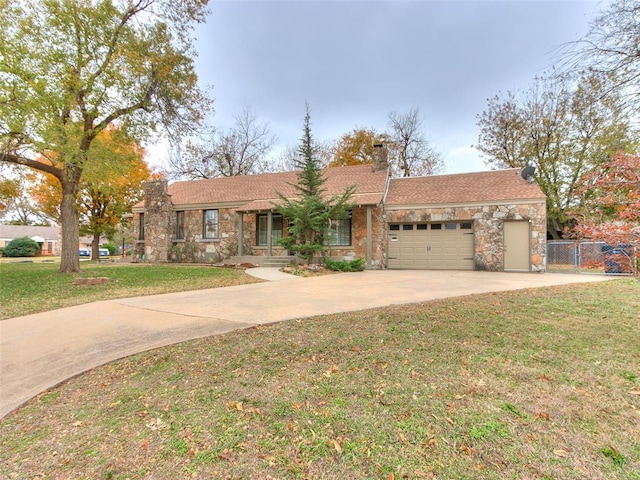 ranch-style home with a garage and a front lawn