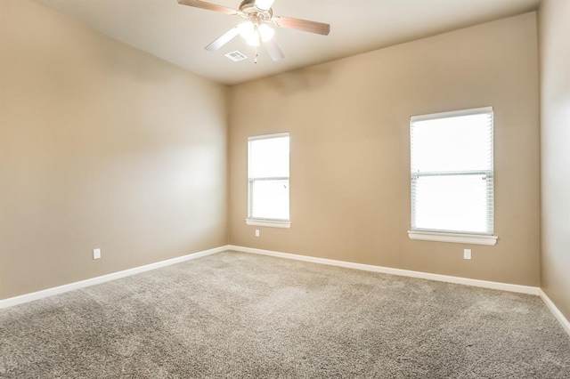 unfurnished room featuring ceiling fan and carpet