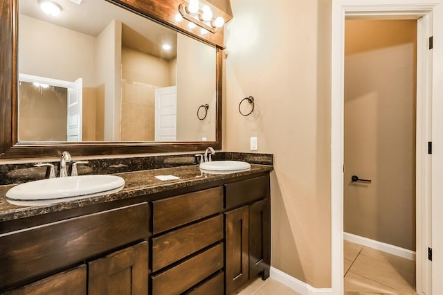 bathroom featuring tile patterned floors and vanity