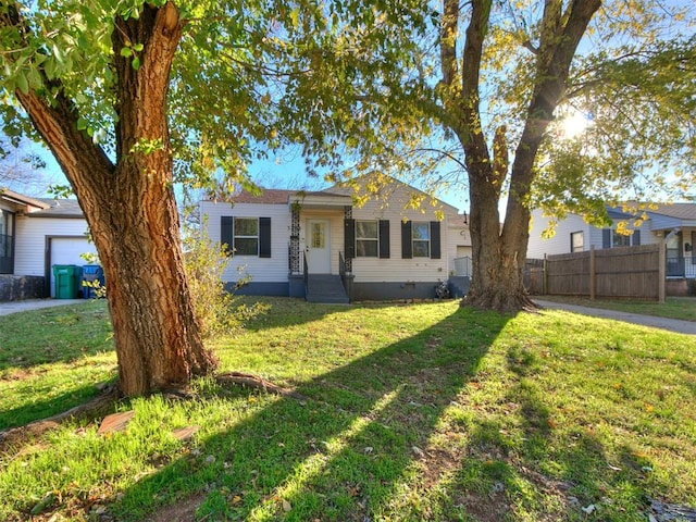 ranch-style home with a front lawn