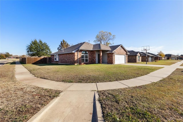 single story home with a front yard and a garage