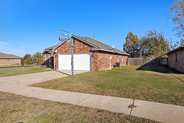 view of property exterior with a yard, a garage, and central air condition unit