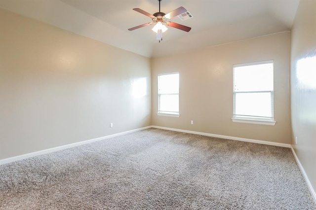 spare room featuring ceiling fan and carpet floors