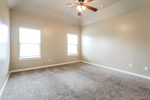 spare room with carpet, ceiling fan, and a healthy amount of sunlight