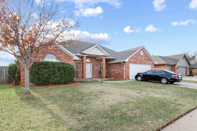 single story home with a garage and a front yard