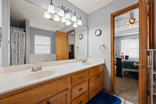 bathroom with vanity and ceiling fan