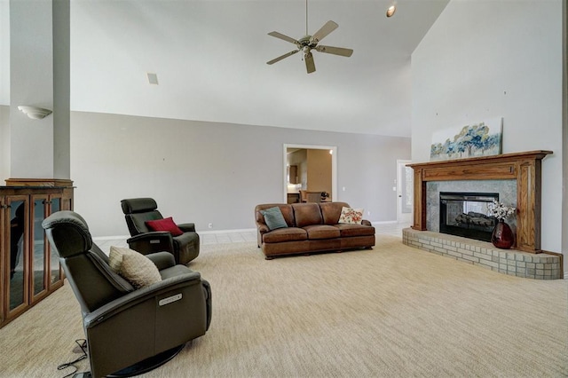 carpeted living room featuring ceiling fan, a fireplace, and high vaulted ceiling