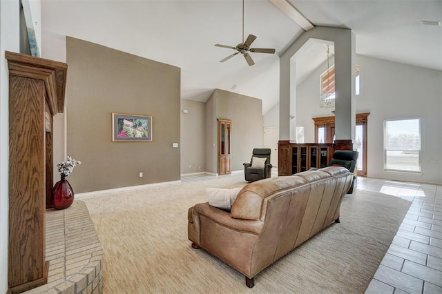 tiled living room with beamed ceiling, high vaulted ceiling, and ceiling fan