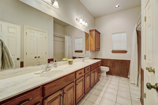 bathroom featuring tile patterned floors, vanity, toilet, and a shower with curtain