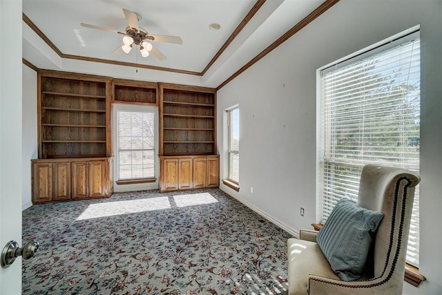 carpeted living room with a wealth of natural light and ornamental molding