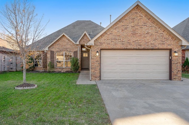 view of front of house with a garage and a front yard