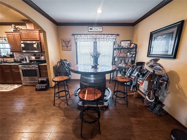 dining room featuring dark hardwood / wood-style flooring and ornamental molding