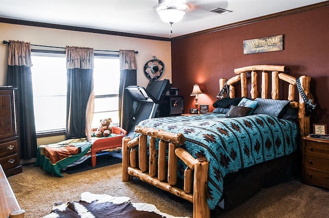 carpeted bedroom with ceiling fan and crown molding