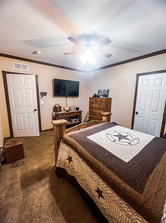 carpeted bedroom with ceiling fan and ornamental molding