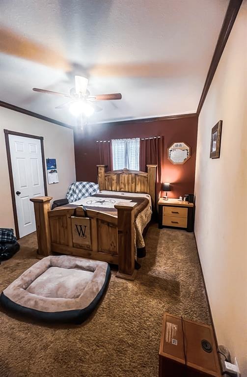 bedroom featuring ceiling fan, carpet floors, and crown molding