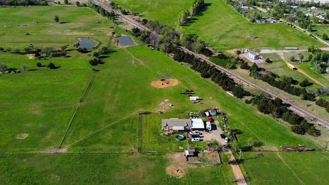 birds eye view of property featuring a rural view