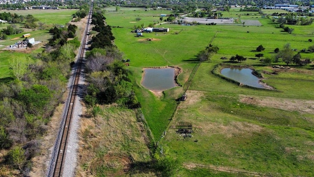 bird's eye view featuring a rural view and a water view