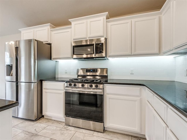 2213 Waterbrook Ct, Norman, OK 73026 - kitchen featuring stainless steel appliances, white cabinets, and decorative backsplash