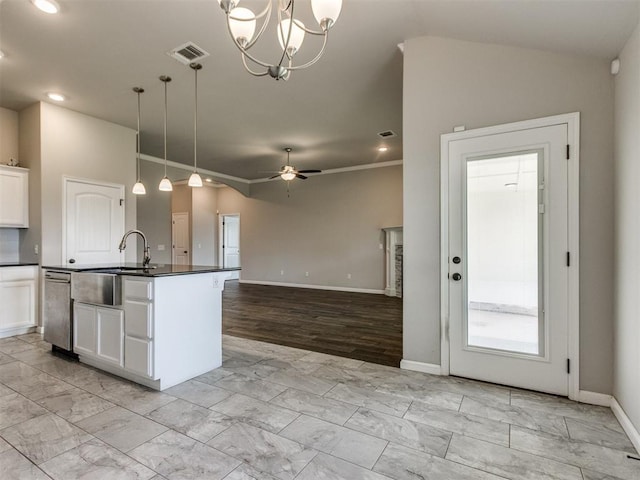 2213 Waterbrook Ct, Norman, OK 73026 - kitchen featuring a sink, dark countertops, stainless steel dishwasher, light marble finish floors, and recessed lighting