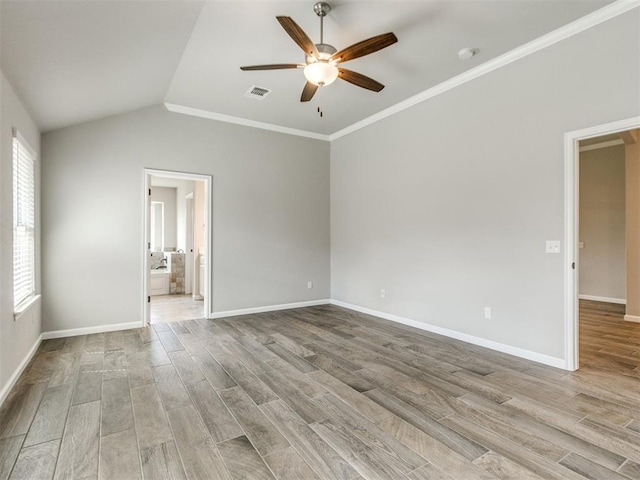 2213 Waterbrook Ct, Norman, OK 73026 - spare room with a ceiling fan, light wood-style floors, baseboards, crown molding, and lofted ceiling
