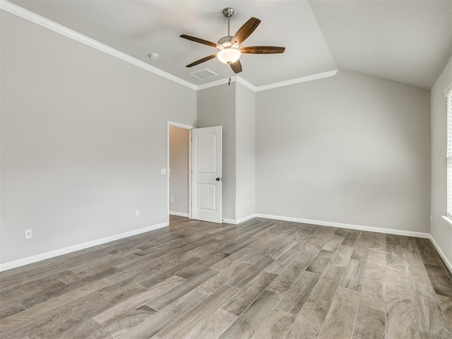 2213 Waterbrook Ct, Norman, OK 73026 - spare room with ceiling fan, wood finished floors, baseboards, lofted ceiling, and ornamental molding