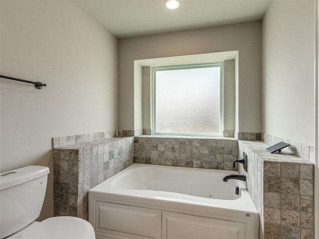 2213 Waterbrook Ct, Norman, OK 73026 - bathroom featuring toilet and a jetted tub