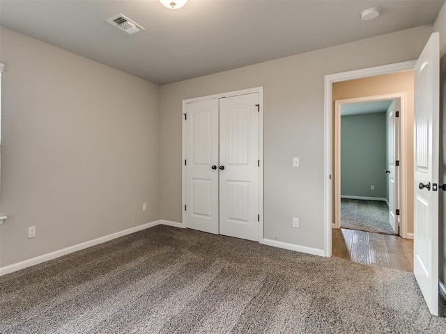 2213 Waterbrook Ct, Norman, OK 73026 - unfurnished bedroom featuring carpet flooring, baseboards, and a closet