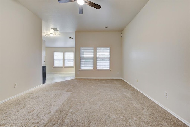 unfurnished living room featuring light colored carpet and ceiling fan